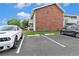 Exterior shot of building with parking space with 2 vehicles at 10150 E Virginia Ave # 13-204, Denver, CO 80247