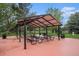 Outdoor picnic area with shaded pavilion, picnic tables, and barbecue grills at 10150 E Virginia Ave # 13-204, Denver, CO 80247