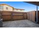 A fenced in backyard space with concrete patio at 1028 Coronado Pkwy # C, Denver, CO 80229