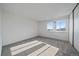 Bright bedroom with carpet floors and a large window, offering a simple, clean aesthetic at 1028 Coronado Pkwy # C, Denver, CO 80229