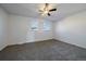 Bright bedroom with neutral carpet, ceiling fan and double windows with natural light at 1028 Coronado Pkwy # C, Denver, CO 80229