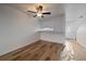 Bright dining area featuring light wood floors, a white door with glass insert, and a ceiling fan at 1028 Coronado Pkwy # C, Denver, CO 80229
