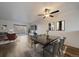 Bright, spacious living room with wood floors, modern furnishings, ceiling fan, and a sliding glass door to the patio at 1028 Coronado Pkwy # C, Denver, CO 80229