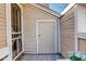 Enclosed outdoor patio area featuring bench seating and a storage closet at 4931 Garrison St # 204G, Wheat Ridge, CO 80033