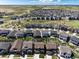 Panoramic aerial view of a vibrant neighborhood with well-maintained homes and scenic surroundings at 6643 Barnstead Dr, Castle Pines, CO 80108