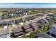Stunning aerial view of a modern community featuring meticulously landscaped streets and contemporary homes at 6643 Barnstead Dr, Castle Pines, CO 80108
