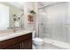 Bathroom with sleek vanity, modern fixtures, and glass-enclosed shower at 6643 Barnstead Dr, Castle Pines, CO 80108