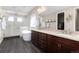 Elegant bathroom featuring a soaking tub, walk-in shower, double vanity, and closet at 6643 Barnstead Dr, Castle Pines, CO 80108