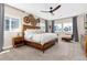 Bright main bedroom boasts carpet, a decorative ceiling fan, and ample natural light at 6643 Barnstead Dr, Castle Pines, CO 80108