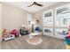 Cozy playroom with carpet, ample natural light, and a variety of toys and play furniture at 6643 Barnstead Dr, Castle Pines, CO 80108