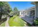 The expansive backyard features lush greenery, a stone pathway, and a serene outdoor space at 16929 W 63Rd Ln, Golden, CO 80403