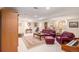 Expansive basement featuring plush seating, decorative furnishings, carpet flooring, and ample natural light at 16929 W 63Rd Ln, Golden, CO 80403