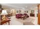 Spacious basement with comfortable seating, piano, decorative rugs, and ample space for entertaining at 16929 W 63Rd Ln, Golden, CO 80403