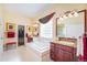 Bathroom with a soaking tub, double vanities, and a separate shower at 16929 W 63Rd Ln, Golden, CO 80403