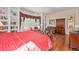 Spacious bedroom with a window seat, bookshelves, and hardwood floors at 16929 W 63Rd Ln, Golden, CO 80403