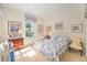 Cozy bedroom with floral accents, a window view, and comfortable furnishings at 16929 W 63Rd Ln, Golden, CO 80403
