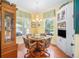 Cozy breakfast nook with built-in shelving, hardwood floors, and lots of light at 16929 W 63Rd Ln, Golden, CO 80403