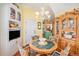 Bright breakfast nook featuring built-in shelving and views into the kitchen at 16929 W 63Rd Ln, Golden, CO 80403