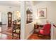 Dining area with hardwood floors, elegant furnishings, and a view to the entryway at 16929 W 63Rd Ln, Golden, CO 80403