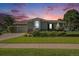 Charming single-Gathering home featuring a well-manicured lawn and stone accents at sunset at 16929 W 63Rd Ln, Golden, CO 80403