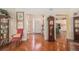 Elegant foyer with hardwood floors, decorative clock, and view into the kitchen at 16929 W 63Rd Ln, Golden, CO 80403
