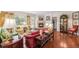 Cozy living room with fireplace, hardwood floors, and ample natural light at 16929 W 63Rd Ln, Golden, CO 80403