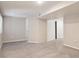 A spacious basement with neutral carpet and light walls presents a blank canvas for customization at 20396 E Berry Pl, Centennial, CO 80015