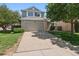 Charming home exterior with a well-manicured lawn, an attached two-car garage, and lovely curb appeal for a welcoming feel at 20396 E Berry Pl, Centennial, CO 80015