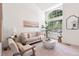 Stylish living room featuring high ceilings, large windows, and comfortable seating offering plenty of natural light at 20396 E Berry Pl, Centennial, CO 80015