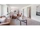 Comfortable living room seamlessly blending with an open kitchen, ideal for modern living and entertaining at 20396 E Berry Pl, Centennial, CO 80015