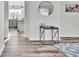 Entryway showcasing a modern console table and view of the kitchen at 3150 S Jasper Way, Aurora, CO 80013