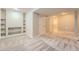 The finished basement features neutral carpet, built in shelves and two access doors at 20431 E Union Cir, Aurora, CO 80015