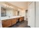 Gorgeous bathroom with double sink vanity, stylish tile flooring, and ample lighting at 20431 E Union Cir, Aurora, CO 80015