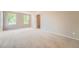 Spacious bedroom featuring neutral carpeting, trim and plenty of natural light from the double windows at 20431 E Union Cir, Aurora, CO 80015