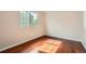 Bedroom featuring a window and shining wood floors at 20431 E Union Cir, Aurora, CO 80015
