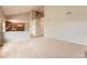 Open-concept living area with soaring ceilings, a loft, and a view of the kitchen at 20431 E Union Cir, Aurora, CO 80015
