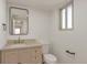 Stylish half-bathroom featuring neutral vanity, modern gold fixtures, and updated design at 3733 W 97Th Ave, Westminster, CO 80031