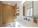 Modern bathroom with stylish wood paneling in the shower and elegant floating shelves at 3733 W 97Th Ave, Westminster, CO 80031