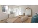 Comfortable bedroom with modern decor, two bright windows, and an elegant mirror at 3733 W 97Th Ave, Westminster, CO 80031