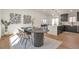 Open dining room featuring wood floors, modern art, and stylish lighting fixtures, perfect for entertaining at 3733 W 97Th Ave, Westminster, CO 80031