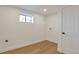 Bright laundry room featuring hardwood floors, window, and washer/dryer hookups at 3733 W 97Th Ave, Westminster, CO 80031