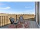 Outdoor deck with stylish seating, a view of the surrounding landscape, and privacy railing at 4355 Cyan Cir # E, Castle Rock, CO 80109