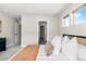 Bedroom with carpet, neutral paint, a modern bed frame and decor, adjacent to a large walk-in closet at 4355 Cyan Cir # E, Castle Rock, CO 80109