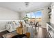 Bright living room with sliding glass doors, contemporary furniture, and a stone fireplace for a modern feel at 4355 Cyan Cir # E, Castle Rock, CO 80109