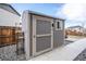 Backyard shed with window, perfect for storing tools and equipment at 3918 S Rome Ct, Aurora, CO 80018