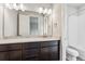 Full bathroom with tub-shower combo, large mirror, and a vanity with a quartz countertop at 2548 Lupton Ln, Lafayette, CO 80026