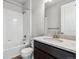A well-lit bathroom showcasing a tub and shower combination and single vanity with a quartz countertop at 2548 Lupton Ln, Lafayette, CO 80026