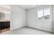Neutral bedroom with a carpet and a view of the bathroom at 2548 Lupton Ln, Lafayette, CO 80026