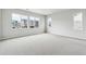 Large bedroom featuring three big windows for natural light and plush carpeted flooring at 2548 Lupton Ln, Lafayette, CO 80026
