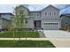 Charming two-story home with a well-manicured lawn and attached two car garage at 2548 Lupton Ln, Lafayette, CO 80026